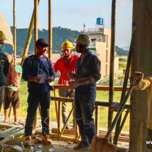 Participants discussing during the hempcrete building workshop